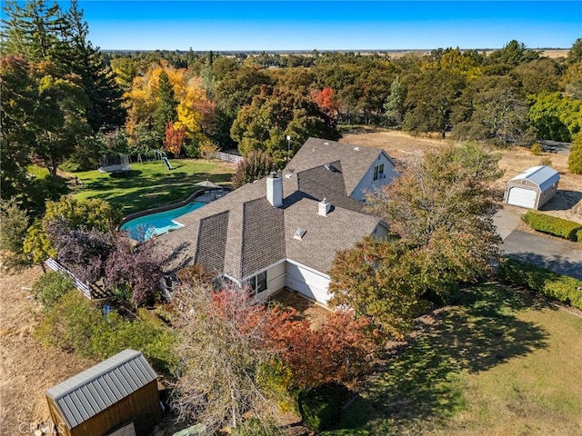 birds eye view of property with a forest view