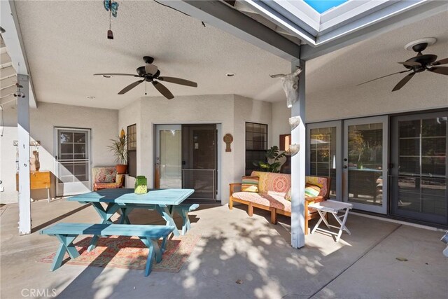 view of patio / terrace featuring ceiling fan