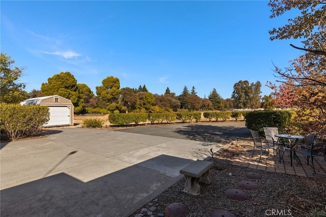 view of patio / terrace with an outbuilding