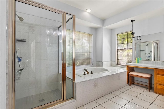full bathroom with a shower stall, tile patterned floors, a garden tub, and vanity