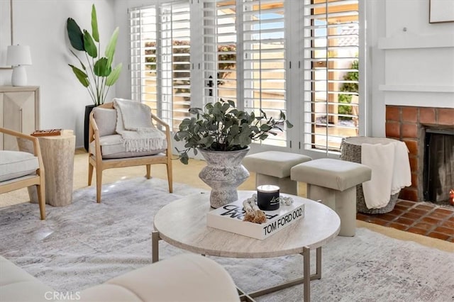 living area with a fireplace and plenty of natural light