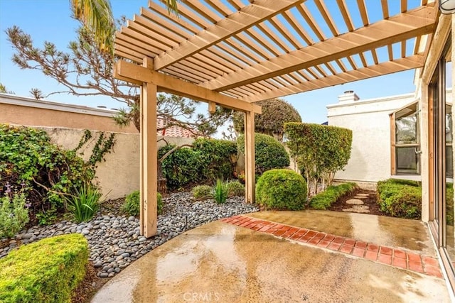 view of patio featuring a pergola