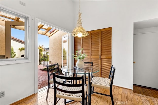 dining area featuring light wood-type flooring