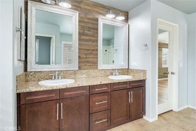 bathroom featuring tile patterned flooring and vanity