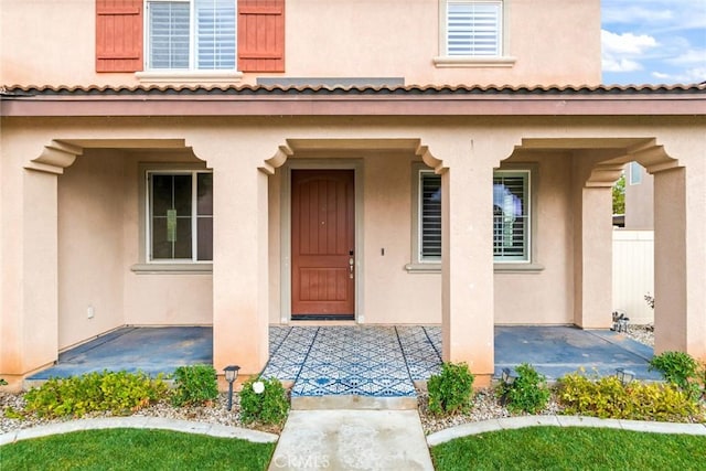 property entrance with a patio