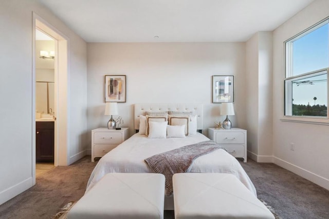 carpeted bedroom featuring connected bathroom