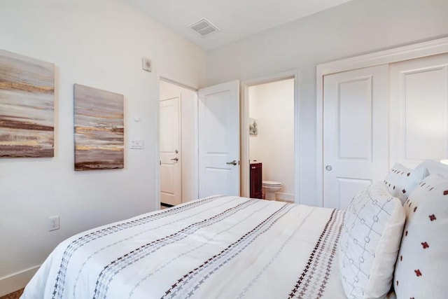 bedroom featuring ensuite bath and a closet