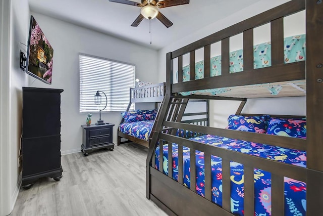 bedroom with wood-type flooring and ceiling fan