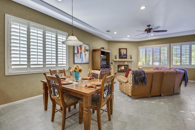 dining area with light tile patterned floors and ceiling fan