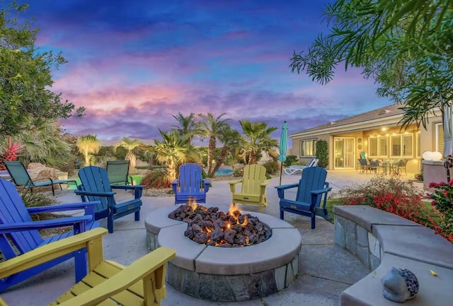 patio terrace at dusk with an outdoor fire pit