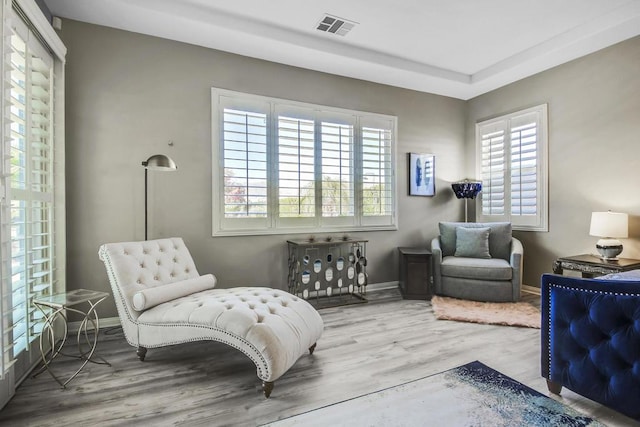 sitting room with hardwood / wood-style flooring