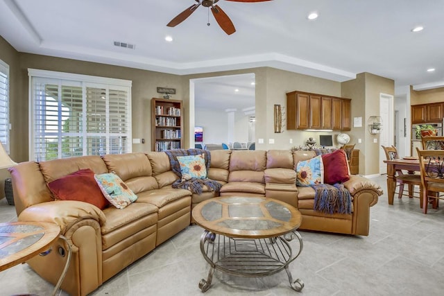 living room featuring ceiling fan and light tile patterned flooring