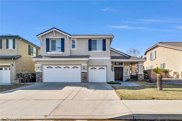 view of front of house featuring a garage and a front yard