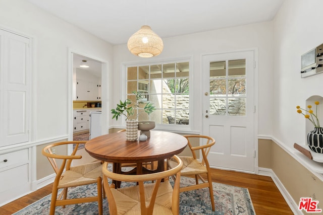 dining area featuring wood-type flooring