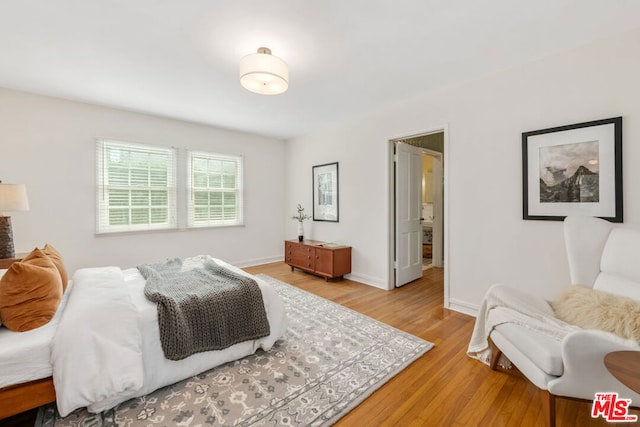 bedroom with light hardwood / wood-style floors