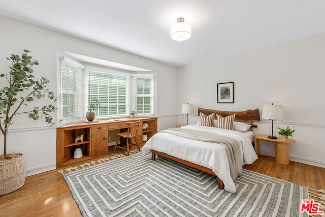 bedroom with light hardwood / wood-style flooring