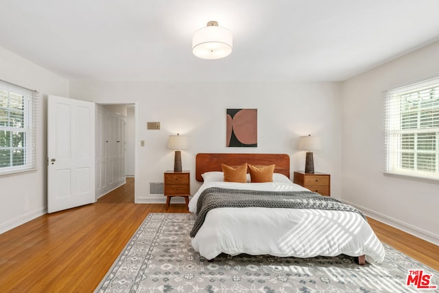 bedroom featuring wood-type flooring