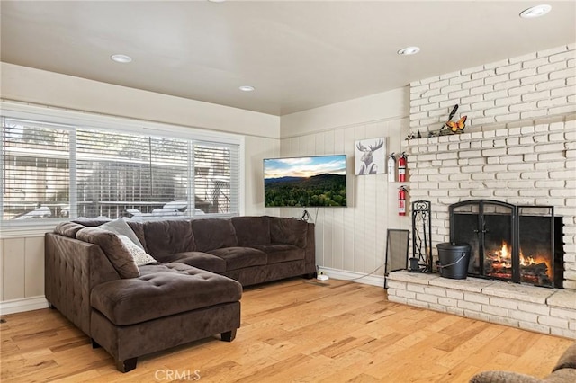 living room featuring hardwood / wood-style floors and a fireplace