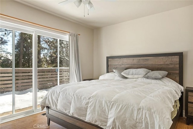 bedroom with hardwood / wood-style floors and ceiling fan