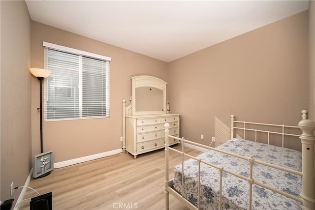 bedroom featuring wood-type flooring