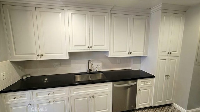 kitchen featuring white cabinetry, sink, decorative backsplash, and stainless steel dishwasher