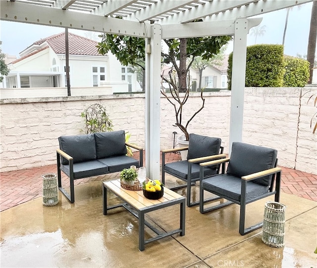 view of patio / terrace with outdoor lounge area and a pergola