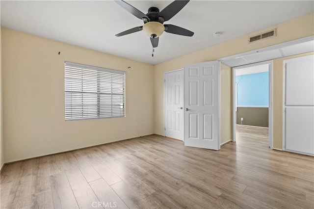 unfurnished bedroom featuring ceiling fan and light hardwood / wood-style flooring