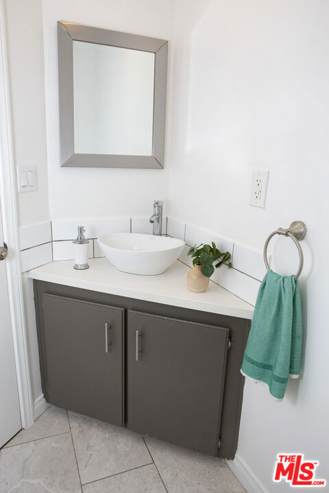 bathroom featuring vanity and tile patterned flooring