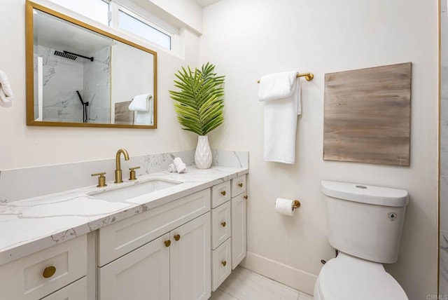 bathroom with walk in shower, vanity, and toilet