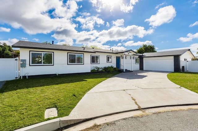 ranch-style home featuring a garage and a front yard