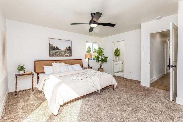 carpeted bedroom with connected bathroom and ceiling fan