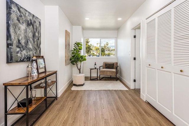 living area with light hardwood / wood-style flooring