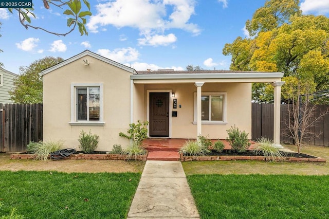 bungalow-style house featuring a front yard and a porch