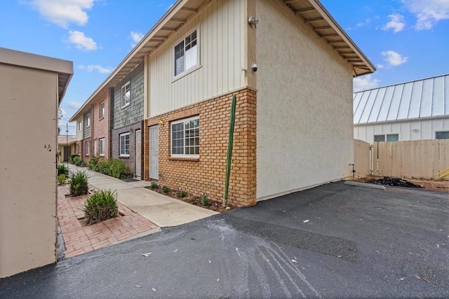 view of side of home with a patio area