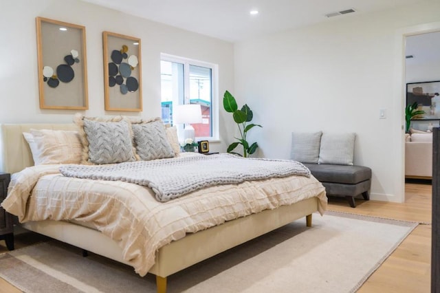 bedroom featuring light hardwood / wood-style floors