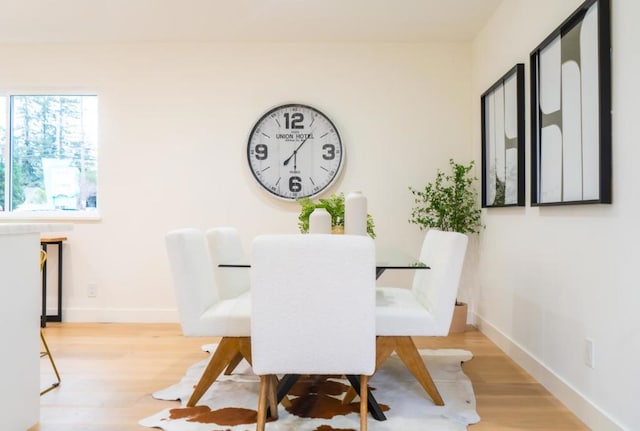 dining area with light wood-type flooring