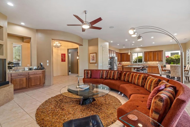 tiled living room with ceiling fan