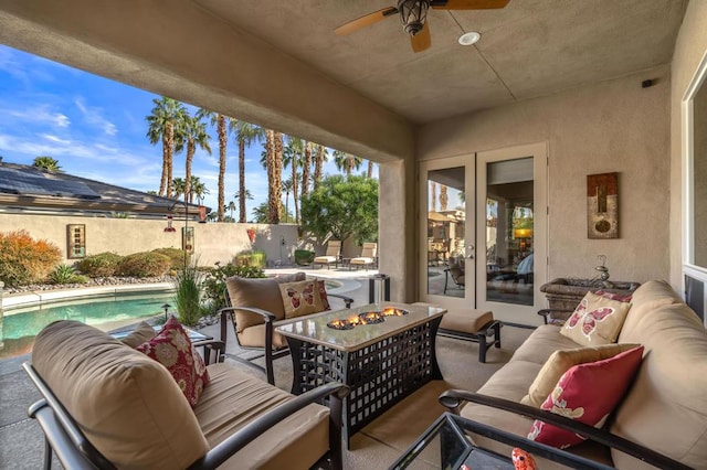 view of patio featuring ceiling fan, an outdoor hangout area, and a fenced in pool