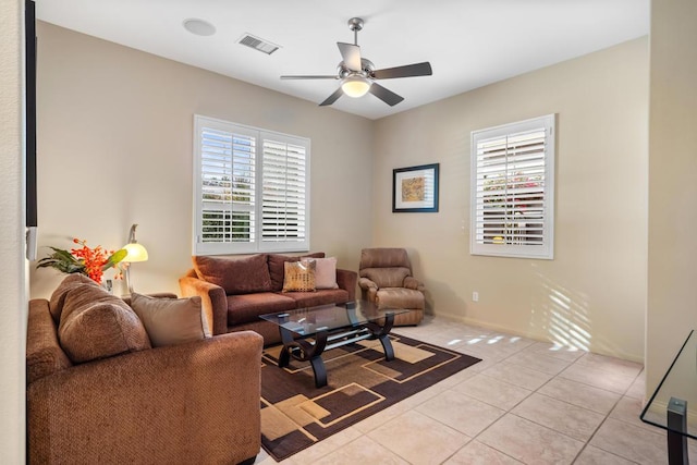 living room featuring light tile patterned floors and ceiling fan