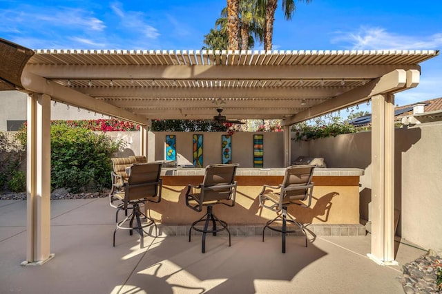 view of patio / terrace featuring a pergola and an outdoor bar