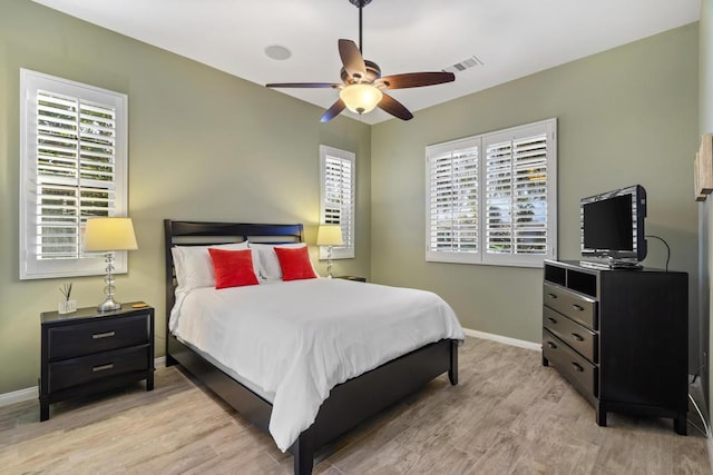 bedroom featuring ceiling fan and light wood-type flooring