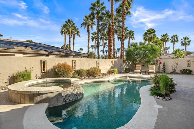 view of pool with an in ground hot tub and a patio