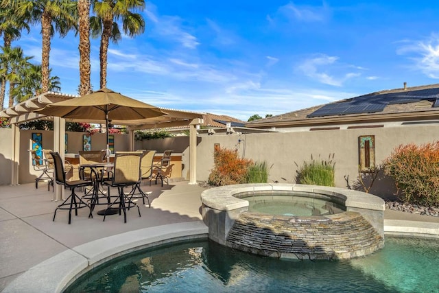 view of swimming pool featuring exterior bar, a patio area, and an in ground hot tub