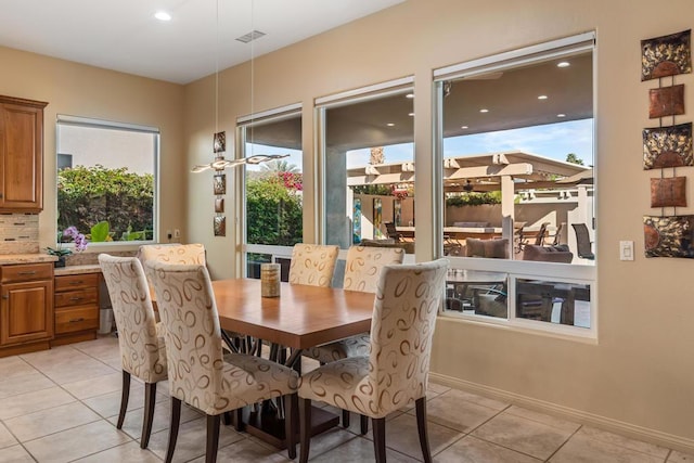 dining space with light tile patterned floors