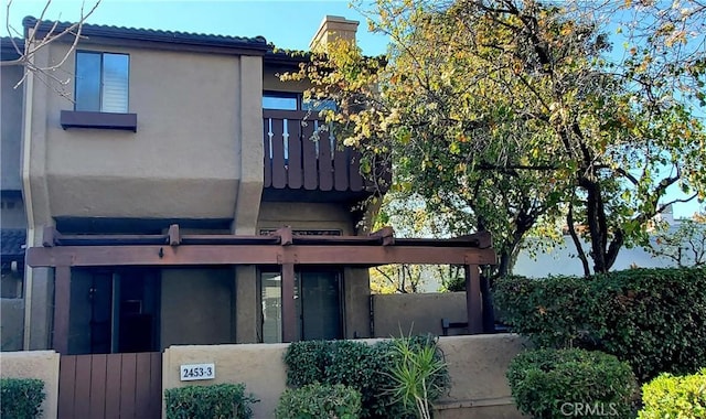 view of home's exterior featuring a balcony