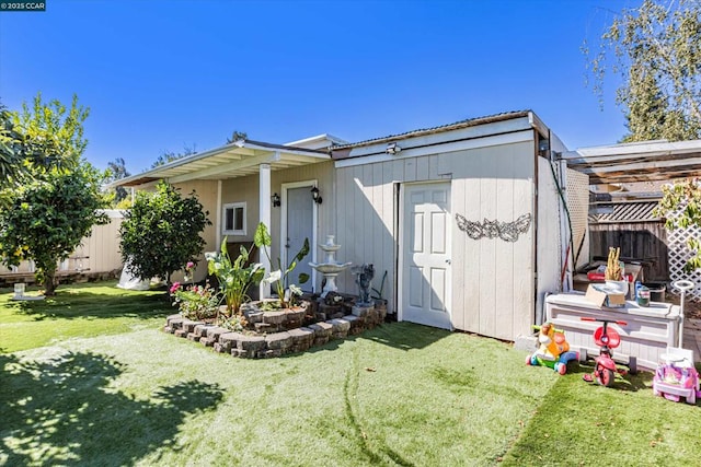 exterior space with a shed and a front yard