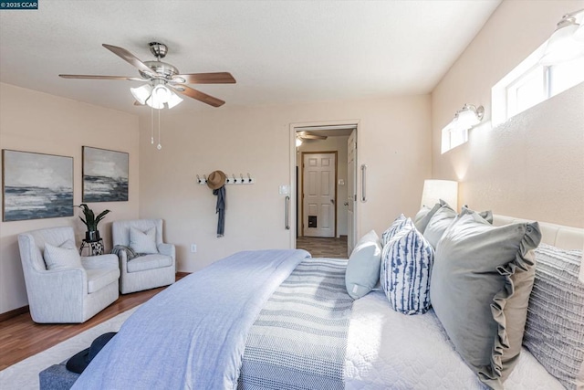 bedroom featuring wood-type flooring and ceiling fan