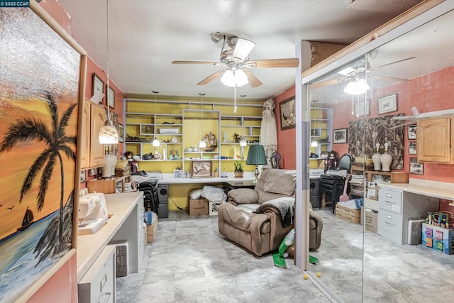 interior space with ceiling fan