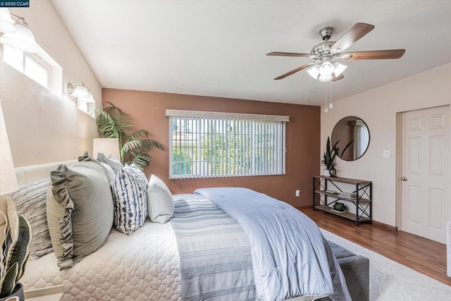 bedroom featuring hardwood / wood-style flooring and ceiling fan