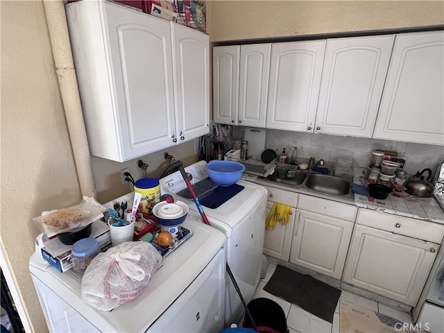 laundry room featuring sink and washer and dryer